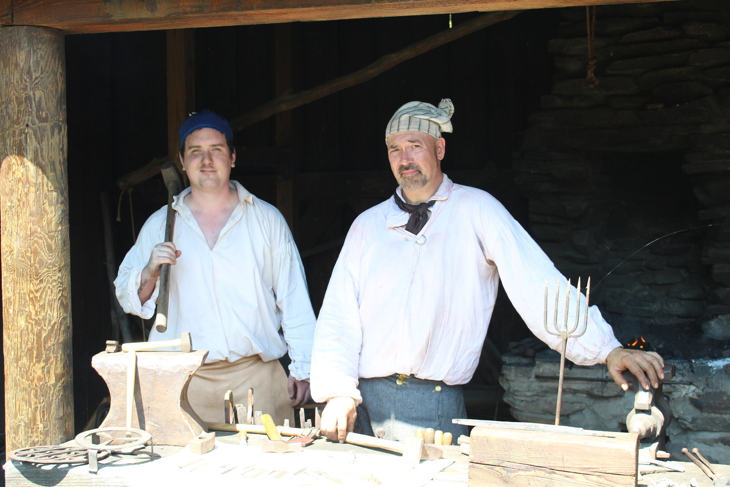 Blacksmiths take a break from forging on a hot day at Fort Delaware.